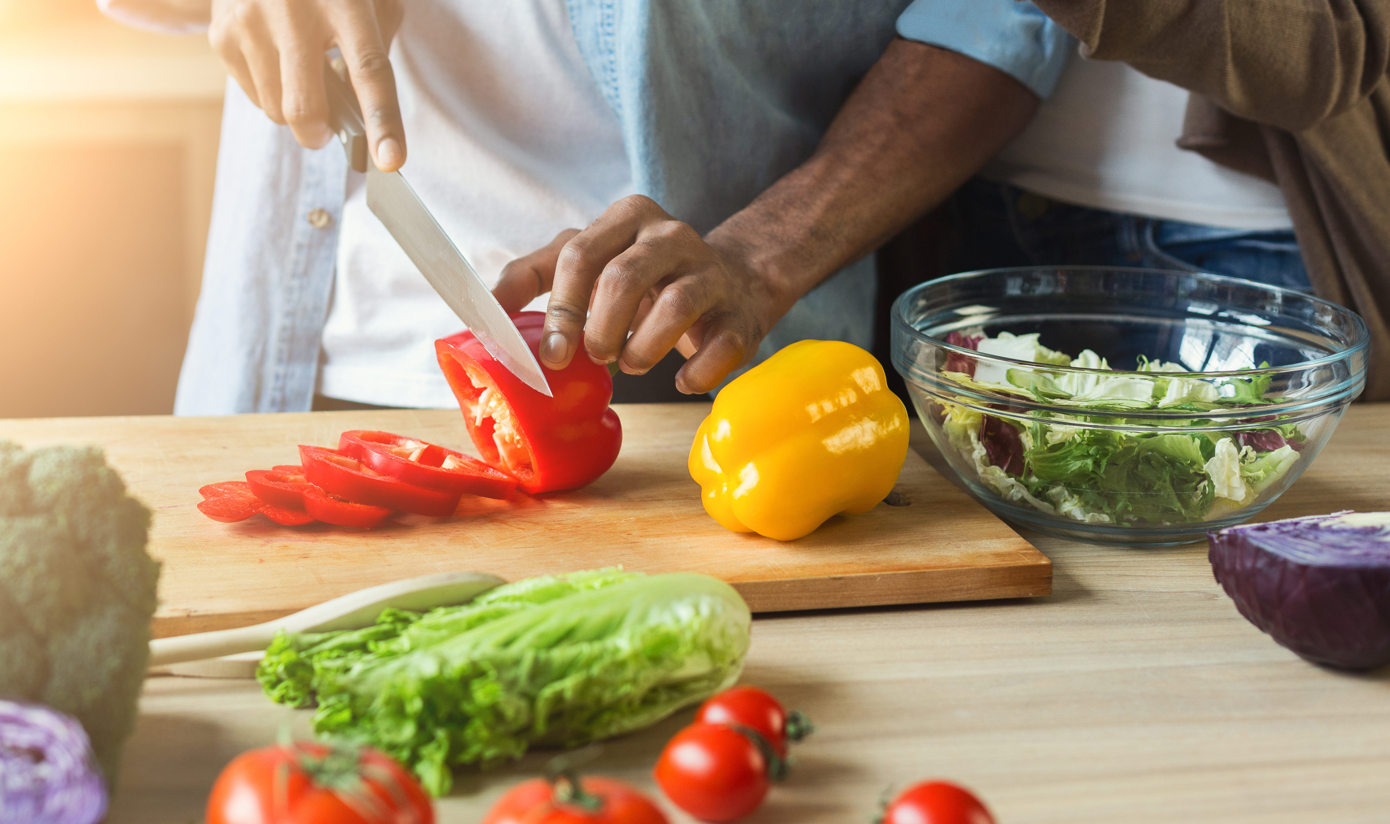 cutting peppers in kitchen