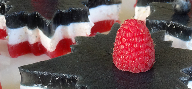 Star-shaped red, white, and blue layered gelatin desserts.