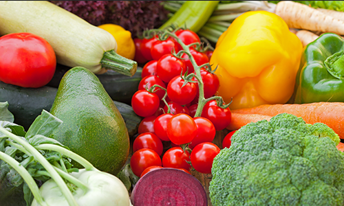 An assortment of summer fruits and vegetables