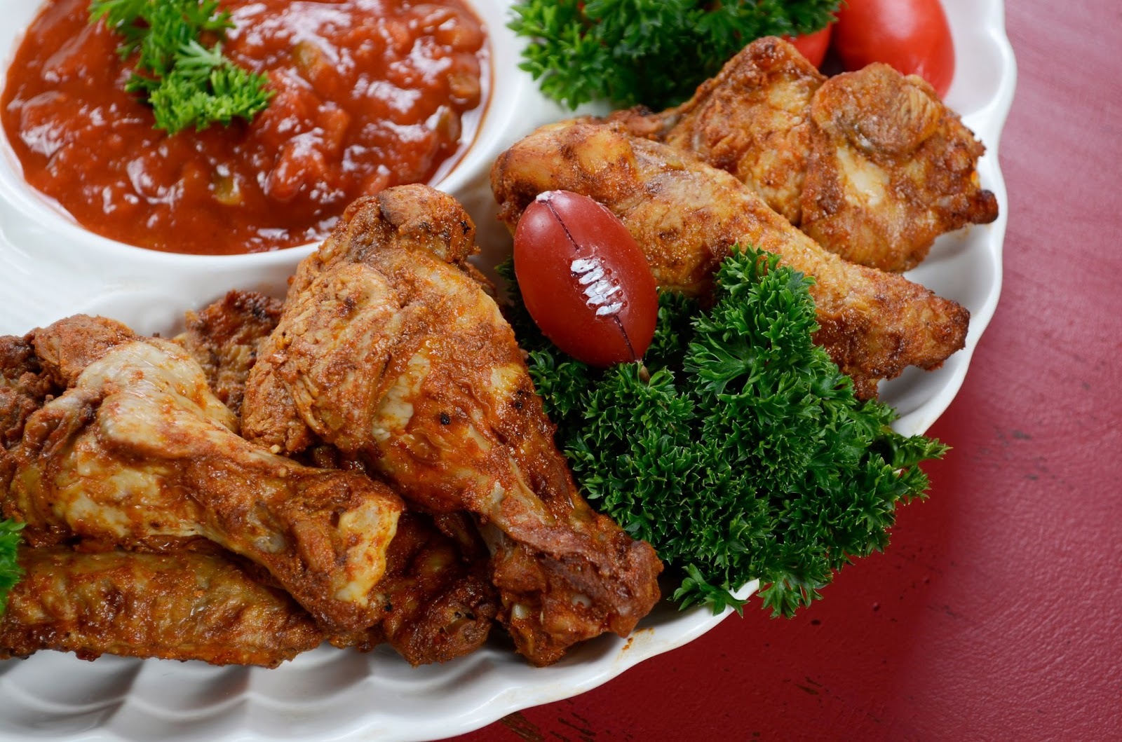 Chicken wings arranged on a platter as keto football snacks.